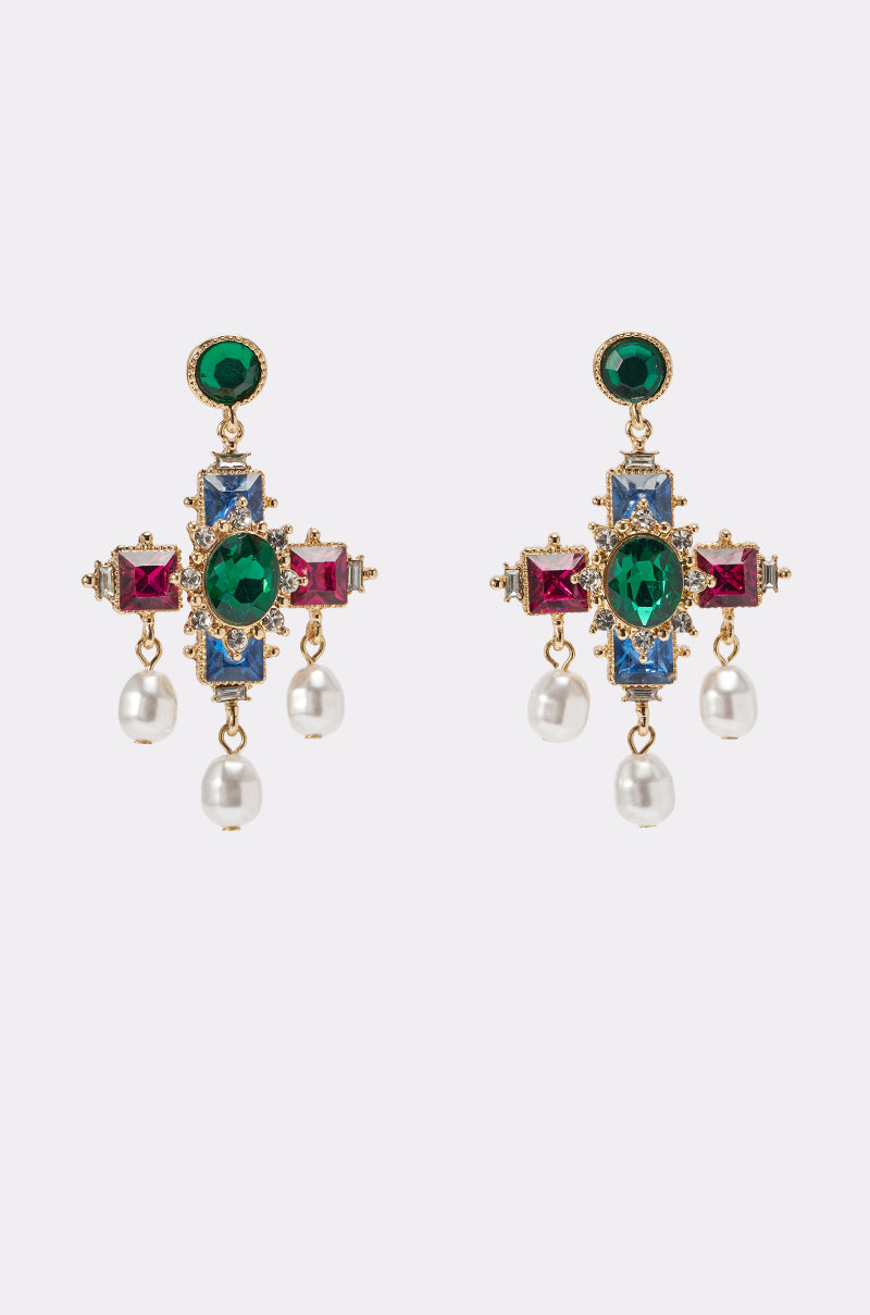 The GLAM EARRING features ornate cross-inspired design with green, blue, and red gemstones, gold detailing, and three dangling white pearls per earring, set against a plain light background. 1
