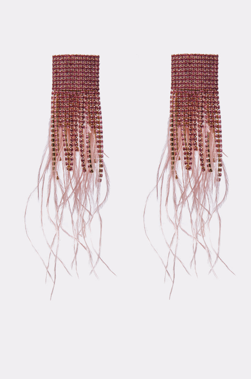 SHAKE IT EARRING: Rectangular pink and gold beaded dangle earrings with long pink feathers and beads, shown on a white background. Add a bold pop of color to any look with these statement feather earrings. 2