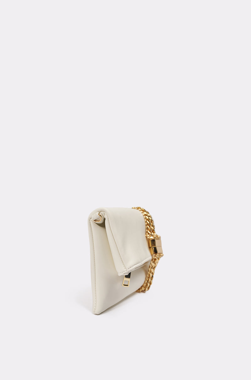 The KIMMY CLUTCH is an elegant white faux leather bag with a flap closure, gold-tone clasp, and gold chain strap—perfect for evenings—shown against a plain white background. 2