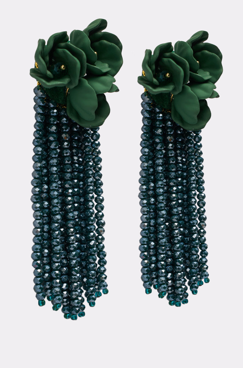 The BERLIN EARRING features dark green flower-shaped tops with multiple strands of shimmering dark blue beaded tassels hanging below. 0