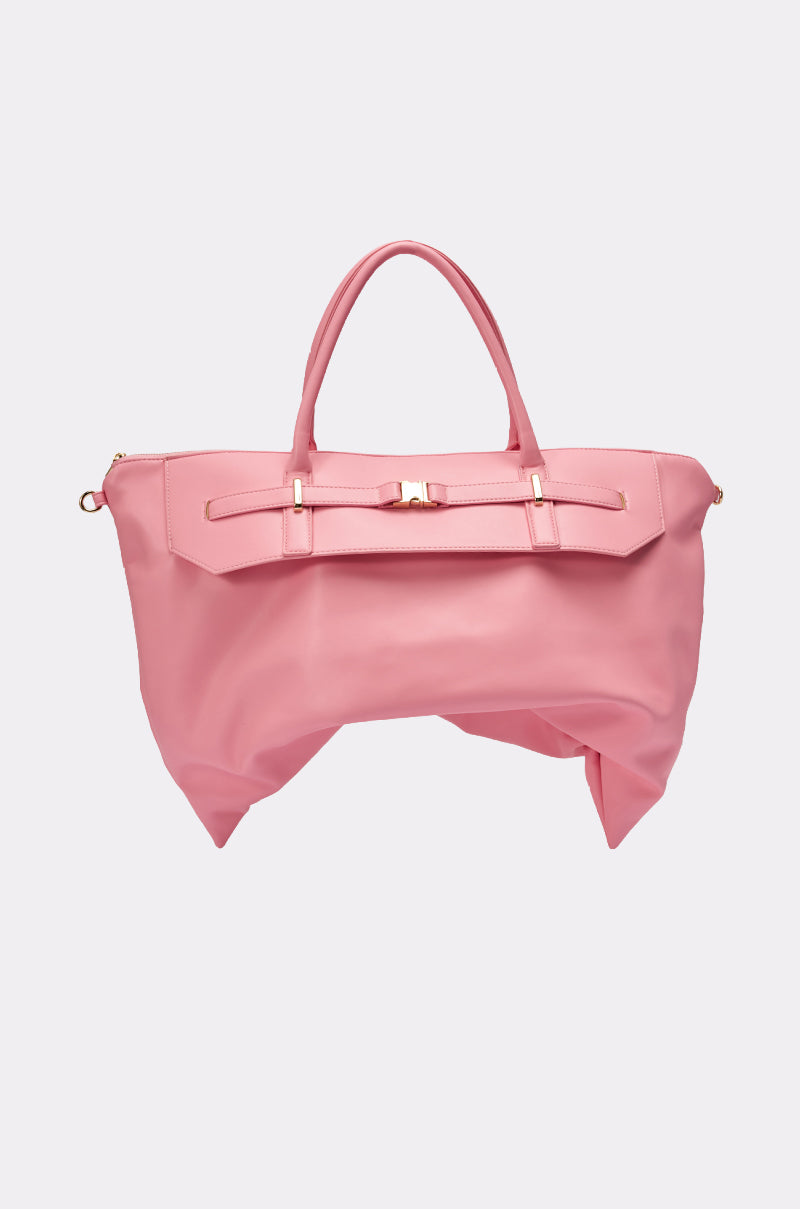 The TAKE A PIC OVERSIZED SLOUCH TOTE IN PINK features soft pink leather, two handles, a removable crossbody strap, and a gold buckle detail on the front, shown against a plain light background. 1