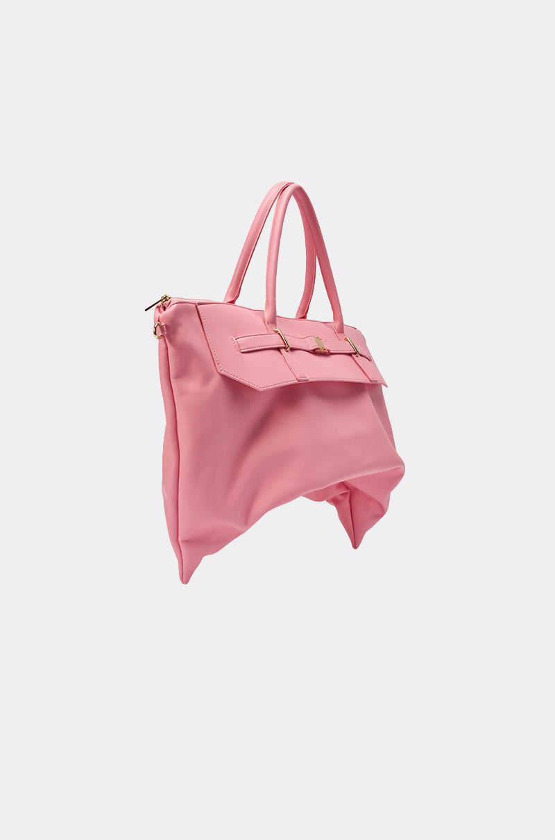 The TAKE A PIC OVERSIZED SLOUCH TOTE IN PINK, made of soft pink faux leather with two handles, gold hardware, and a relaxed, unstructured shape, is displayed on a plain light background. 2