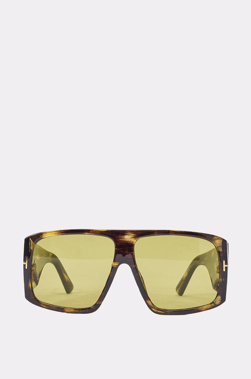 WATCH YOURSELF SUNGLASSES feature a rectangular retro design with yellow-tinted lenses and tortoiseshell frames, photographed against a plain light background. 0