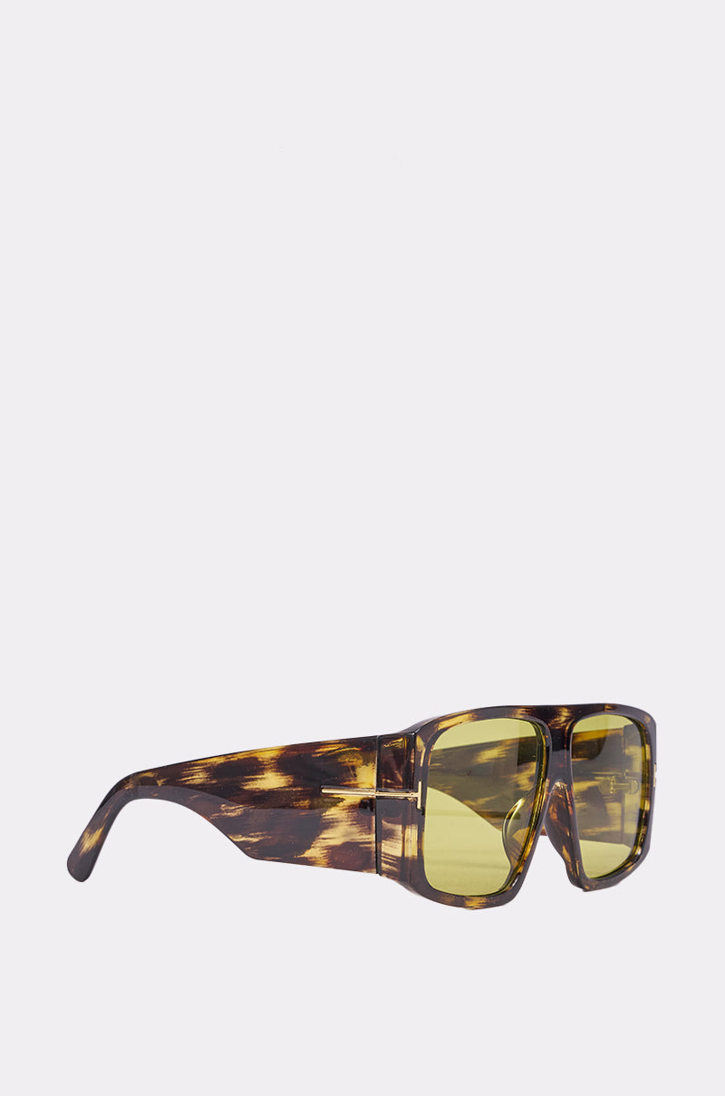 The WATCH YOURSELF SUNGLASSES feature tinted yellow lenses and a thick brown tortoiseshell frame, displayed against a plain white background. 3
