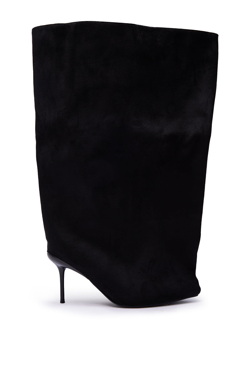 The AZALEA WANG ABAWI BLACK EXTREME BOOT IN SUEDE is a black stiletto heel boot with a tall, wide slouchy shaft and pointed toe, crafted from soft suede-like material and shown against a white background.