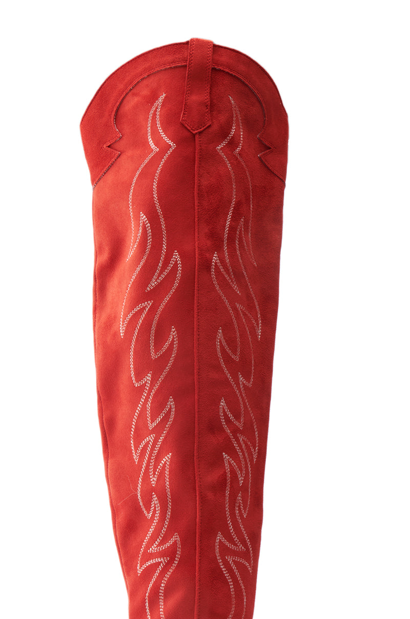 The ABBY RED HIGH SHAFT WESTERN BOOT in rich faux suede showcases intricate flame-inspired white embroidery, creating a bold and stylish pattern along the boot's length. 5
