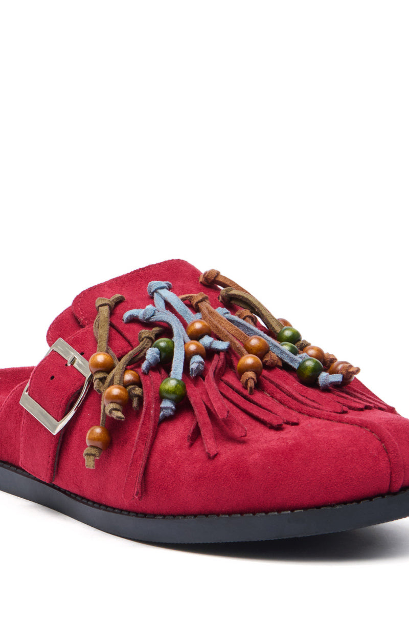The AZALEA WANG ABEILLE BURGUNDY FAUX SUEDE FRINGE CLOG features a silver buckle, fringe, colorful beads, and knotted leather straps on the upper for a bohemian look, all set atop a black sole.