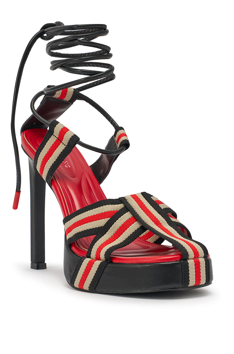 The AZALEA WANG ABILENE Black Multi Striped Strappy Chunky Sandal features red, black, and beige striped fabric straps, a red insole, black sole, and stylish lace-up ankle ties for a bold platform look. 7