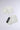 The GET WITH IT GLOVES are white faux leather fingerless gloves featuring rhinestone edging and a black "AKIRA" label on one glove, displayed against a light gray background.