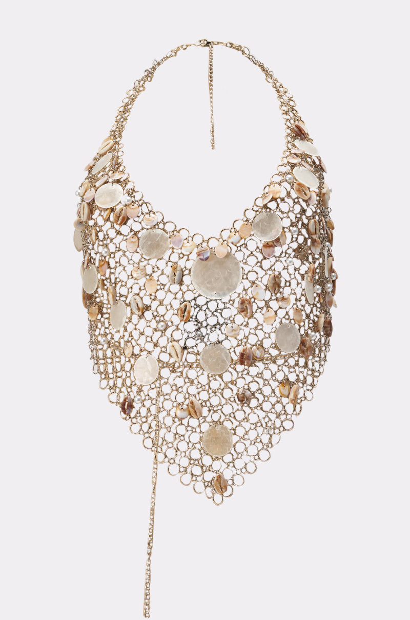 Add bold flair to your look with this dramatic necklace, featuring gold mesh rings and shiny gold discs in a triangular bib shape—perfect for elevating your SALLY SELLS SEASHELLS CROCHET HALTER TOP. Adjustable chain clasp included. 8