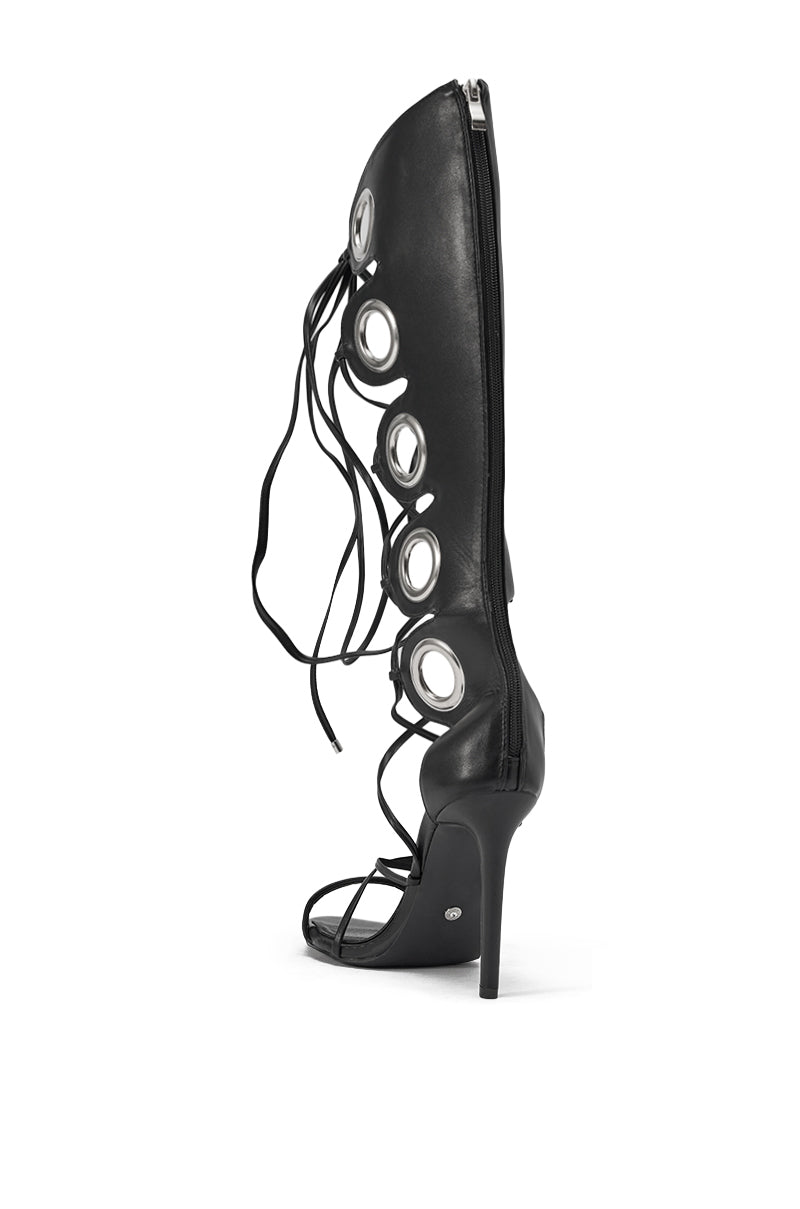 The AZALEA WANG AGATHON Black Gladiator Stiletto Sandal features a tall shaft, large circular cutouts, lace-up details, and a back zipper—ideal for bold strappy heel lovers. 5