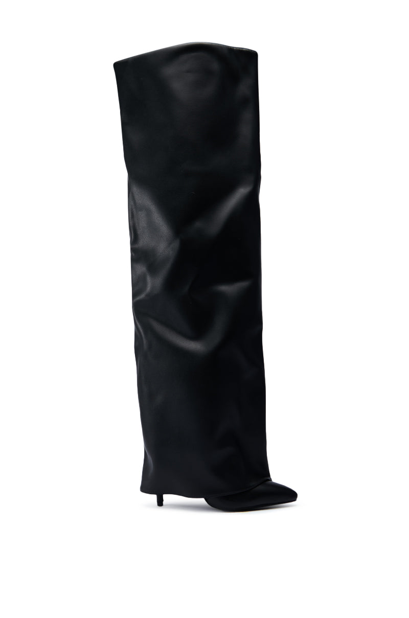 The AZALEA WANG AGUILAR BLACK THIGH HIGH SUSPENDER BOOT is showcased against a simple white backdrop, featuring a sleek and modern design with a stiletto heel and a relaxed fit in faux leather.
