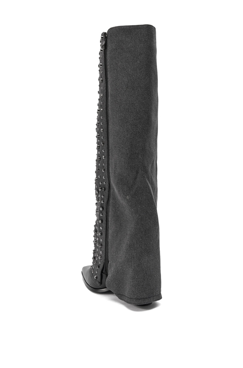 The AZALEA WANG AGUSTUE BLACK STUDDED WESTERN BOOT is shown from a rear side angle. This knee-high boot features a fabric-like texture and small studs along the outer side for added flair.