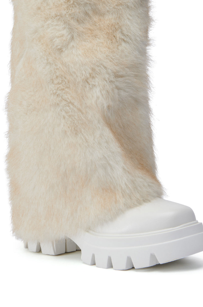 Introducing the AZALEA WANG ASHOKA WHITE FUZZY FLATFORM MID CALF BOOT, a stylish design featuring a close-up image of a mid-calf boot enveloped in fluffy, light beige faux fur. This boot is complemented by a thick white platform sole and rugged tread, effortlessly combining modern aesthetics with the charm of chunky block heels.