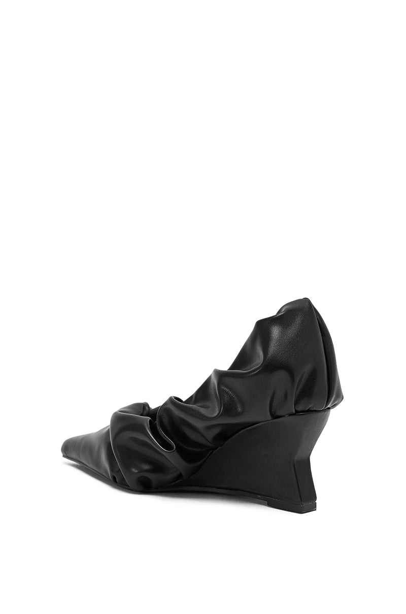 The AZALEA WANG AICHA BLACK RUCHED WEDGE PUMP features a pointed toe and gathered faux leather upper in black, shown against a plain white background.