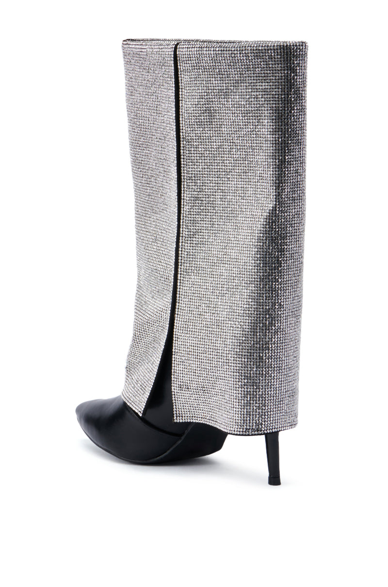 The AZALEA WANG AISLING BLACK SPARKLE COVERED HEEL BOOT features a pointed toe and an overlaid metallic mesh fabric that extends halfway up. The shimmering silver finish enhances the sleek, modern design of this faux leather boot, creating an elegant look when positioned on a white background. 4
