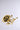 The COME TO THE GARDEN RING, a gold-colored metallic piece with an intricate rose design featuring detailed petals, leaves, and stem, is displayed against a plain light gray background.