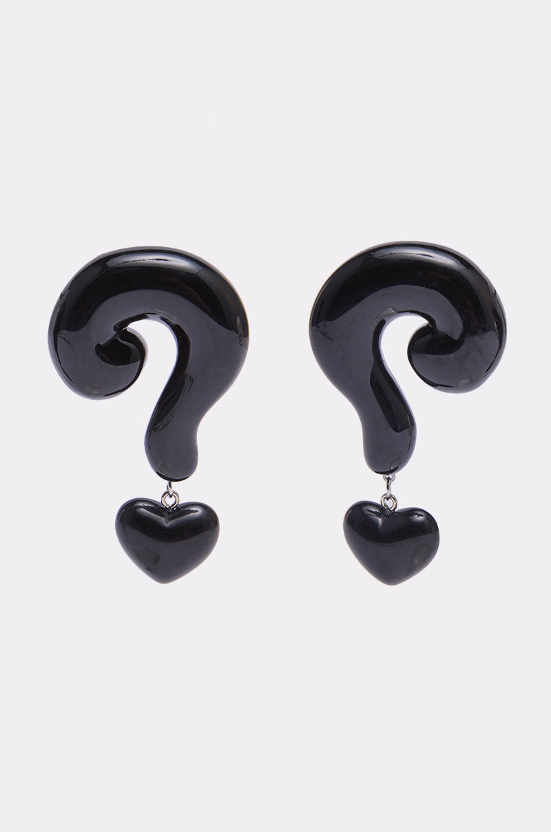 The NO QUESTIONS EARRING is a pair of black acrylic earrings shaped like question marks with a heart-shaped pendant, making a bold statement—shown on a plain white background. 0