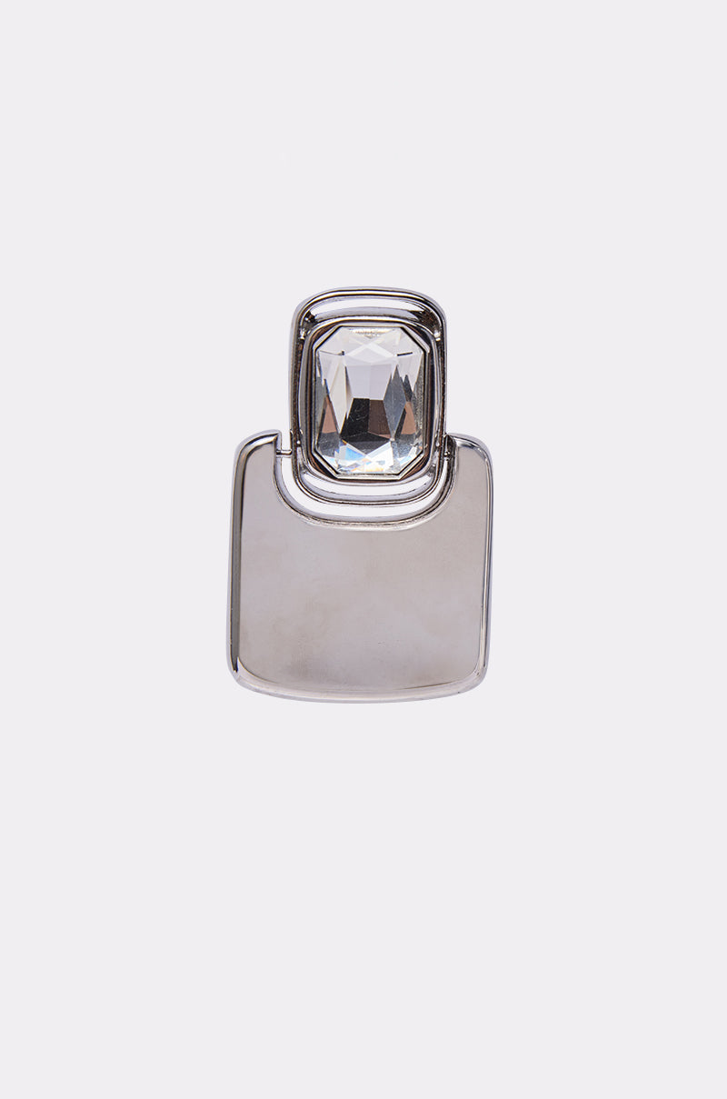 The MOD EARRING is a silver earring featuring a rectangular faceted clear gemstone at the top and a smooth, flat square lower section, shown on a plain white background. 3