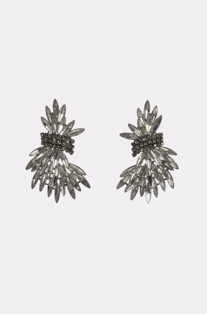 The CICI EARRING is a pair of silver statement drop earrings with a fan-inspired design, featuring marquise-shaped stones radiating outward and a central cluster of small round rhinestones.