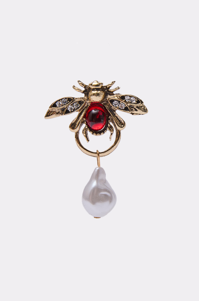 Pair the vintage-inspired OLD MONEY EARRING with a jeweled bee brooch featuring a bold red gemstone body, intricate wings adorned with small white stones, and a single dangling white pearl for a classic look. 3