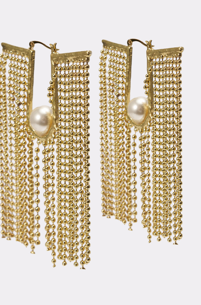 The U DONT GET IT EARRING features gold-tone fringe drops with multiple dangling chains and a striking pearl accent on each, shown against a white background. 3