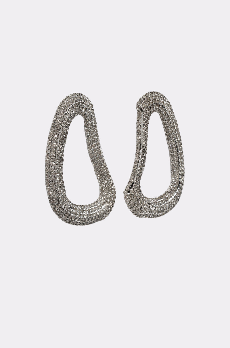 The GALA EARRING is a pair of silver-tone, irregular oval abstract earrings adorned with small rhinestones, shown on a plain white background. 2