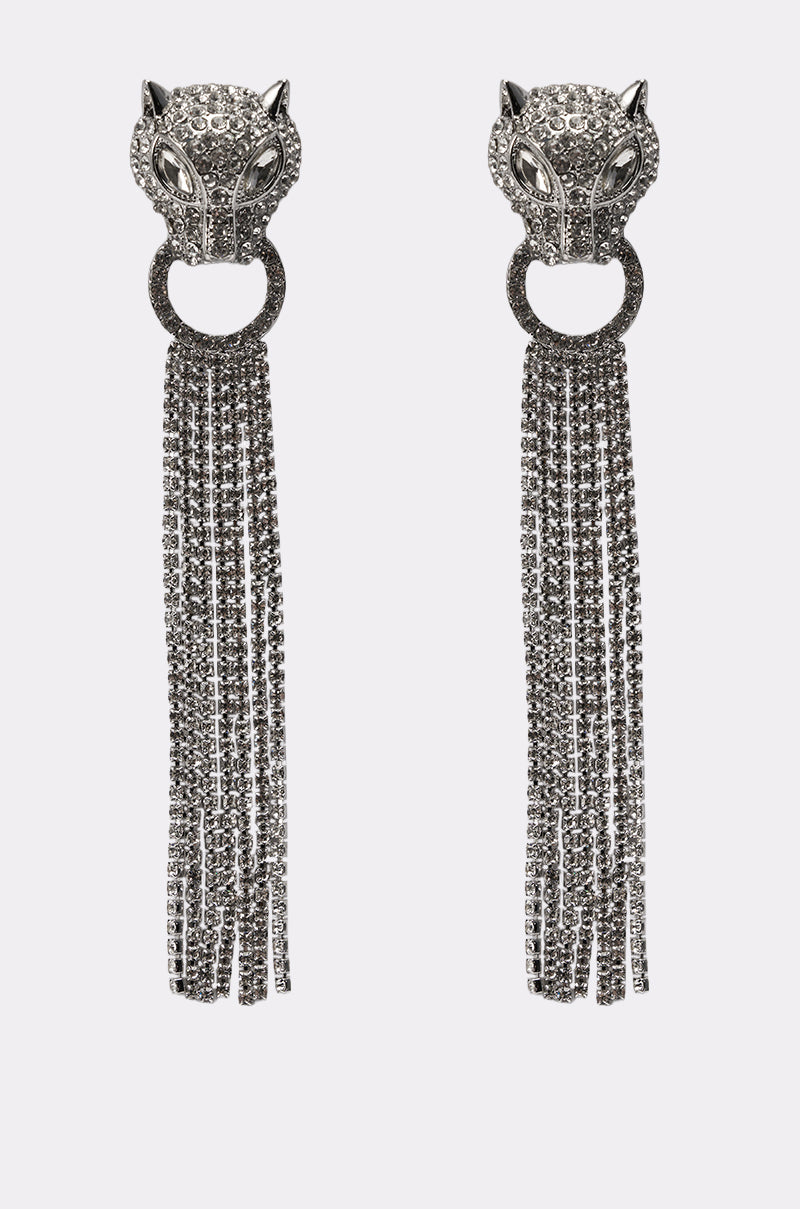 AT THE GALA EARRING: Silver statement earrings featuring rhinestone-encrusted panther heads holding rings, with multiple strands of sparkling chains dangling below. 0