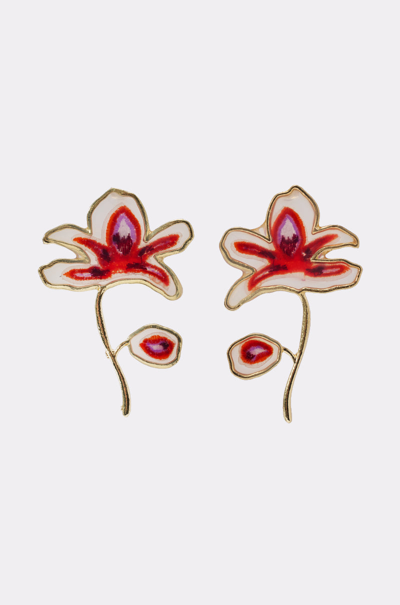 IN THE GALLERY EARRING: Floral statement earrings featuring stylized red and white flowers with gold outlines, each with a main bloom and smaller bud on a curved stem—an elegant vacation accessory for any getaway look. 1