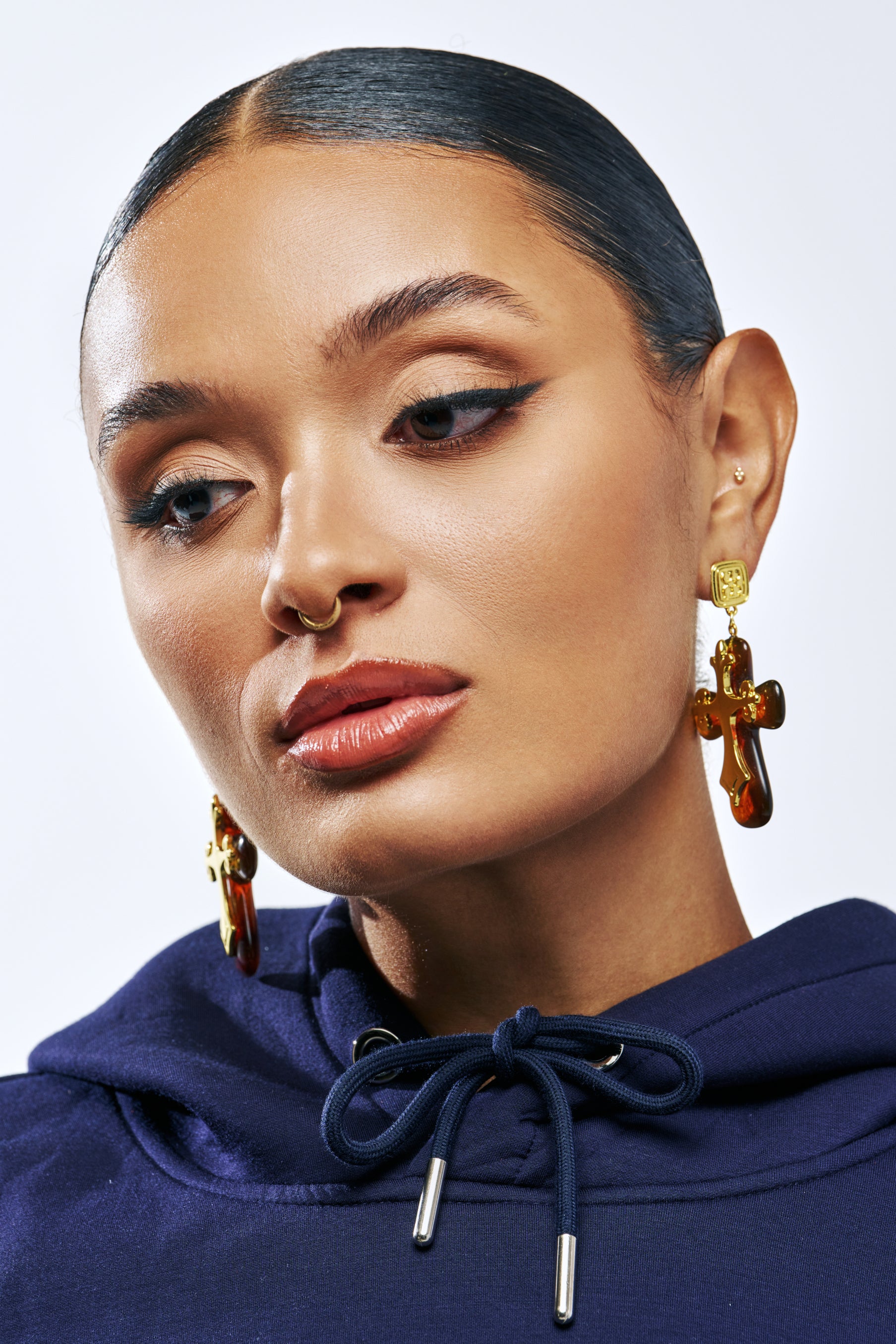 CROSS MY HEART EARRING featuring gold-tone overlay crosses with brown, translucent tortoiseshell centers.