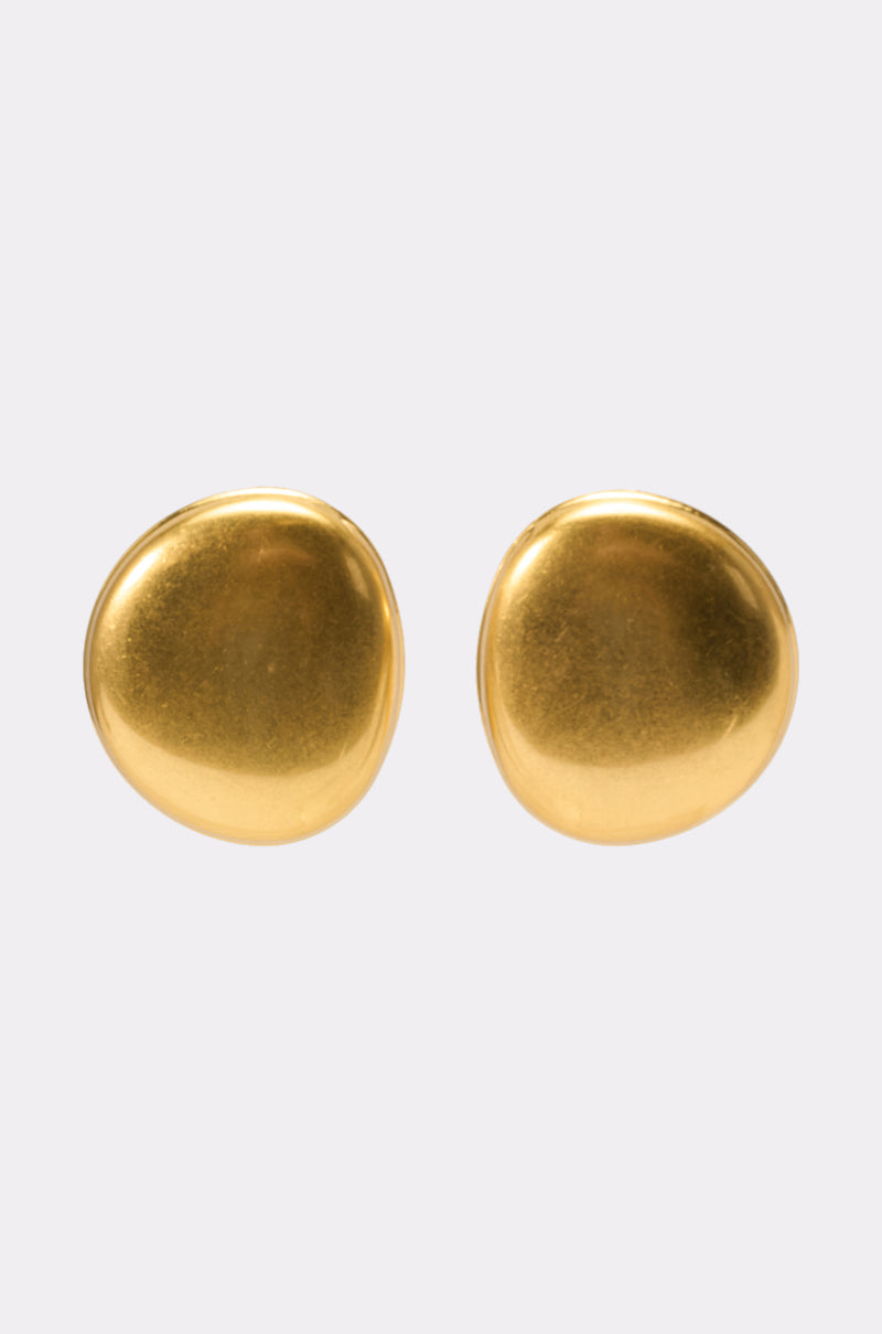 The IN TUSCANY EARRING features round, smooth, gold-tone studs with a slightly irregular, organic shape, shown against a light gray background. 2