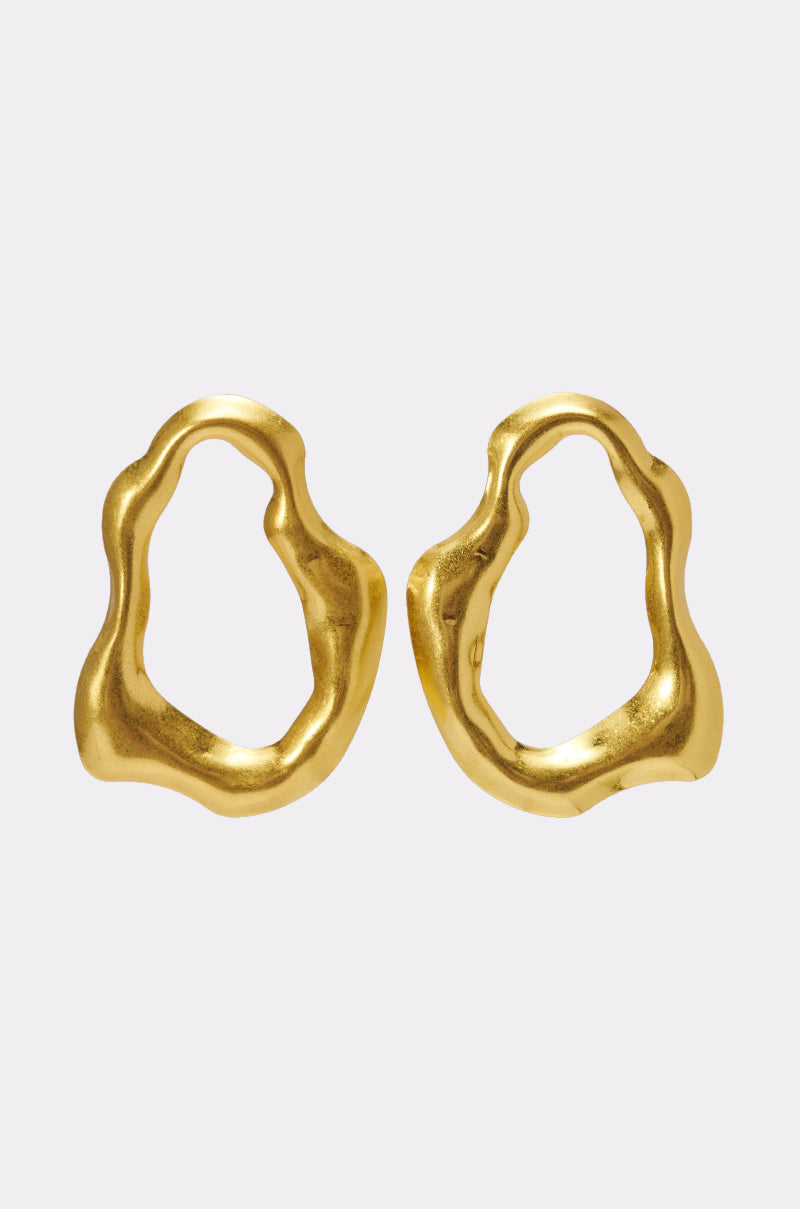 The TEMPTED EARRING features abstract, asymmetrical sculptural designs with organic, irregular open shapes, showcased on a simple light background. 0