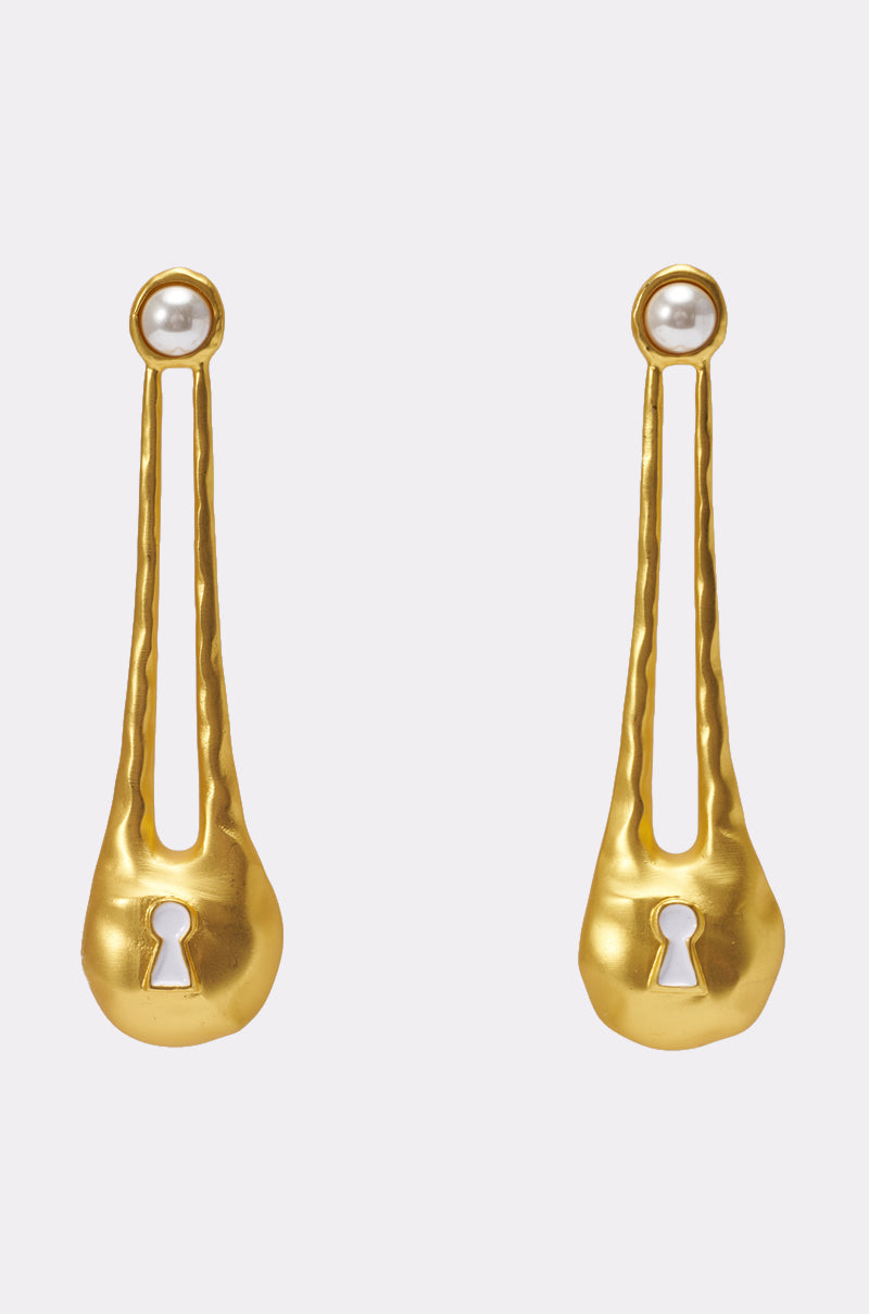 The FIND THE KEY EARRING is a gold lock drop earring with a pearl at the top and a keyhole-shaped cutout near the bottom, displayed on a light gray background. 0