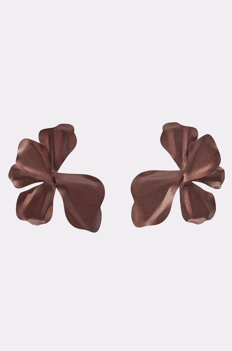 The YUMMY EARRING is a pair of chocolate brown, metallic, flower-shaped earrings with petal designs—ideal summer accessories—shown on a white background.