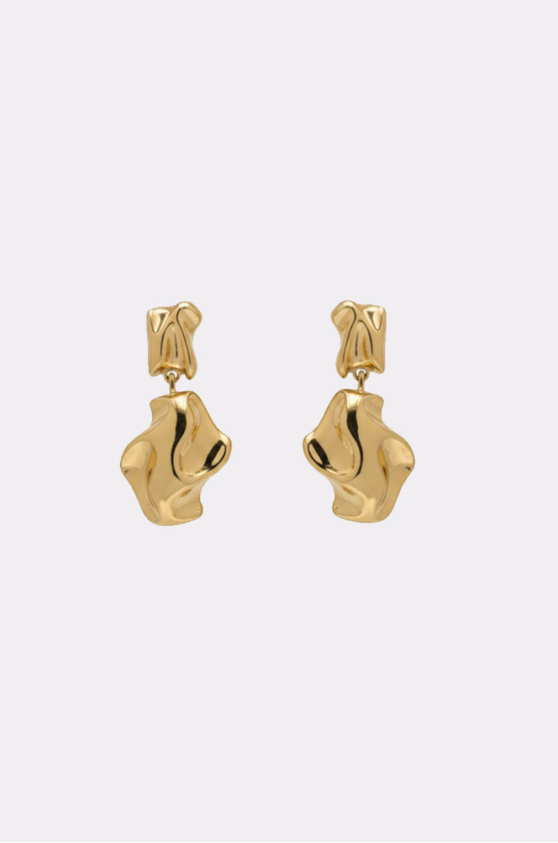 The LEAVE ME ALONE EARRING is a pair of statement faux gold earrings with abstract, irregular shapes and a shiny, reflective finish, shown against a plain light background. 1