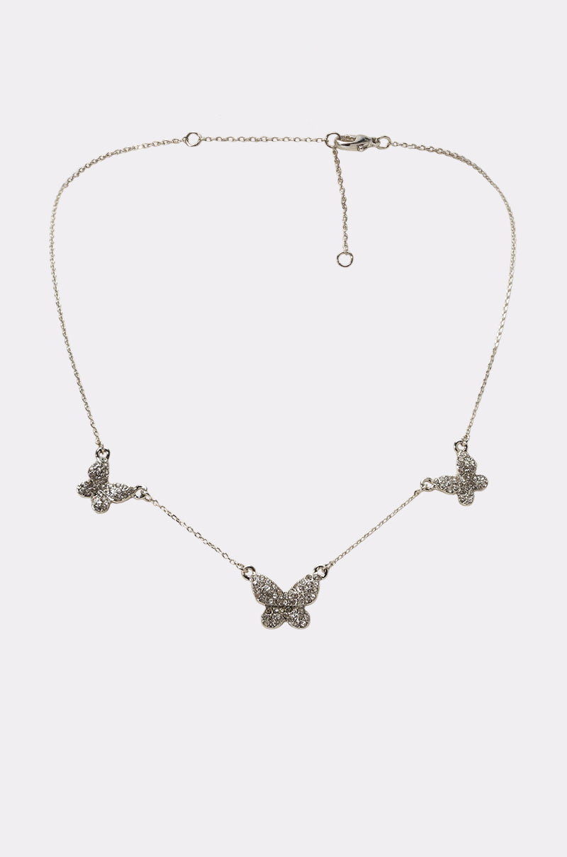 The Y2K VIBES NECKLACE features three butterfly-shaped pendants with sparkling stones on an adjustable silver chain and secure clasp.