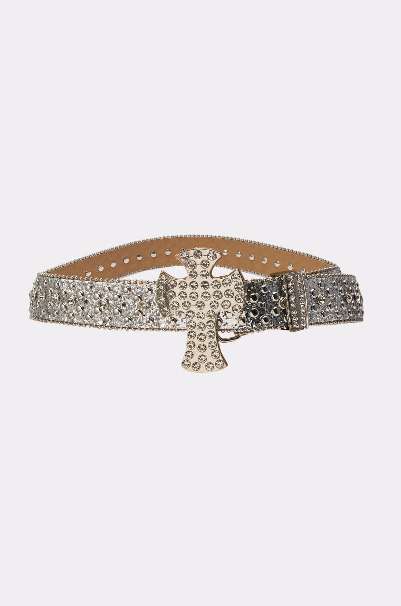 The IM BETTER BELT is a western-style silver belt adorned with sparkling rhinestones and an oversized, rhinestone-encrusted cross buckle, shown against a plain white background. 4