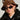 A person wearing the WEAR MY STARS CHEETAH BUCKET HAT, oval-shaped dark sunglasses, hoop earrings, and a black leather jacket gazes directly at the camera against a neutral background.