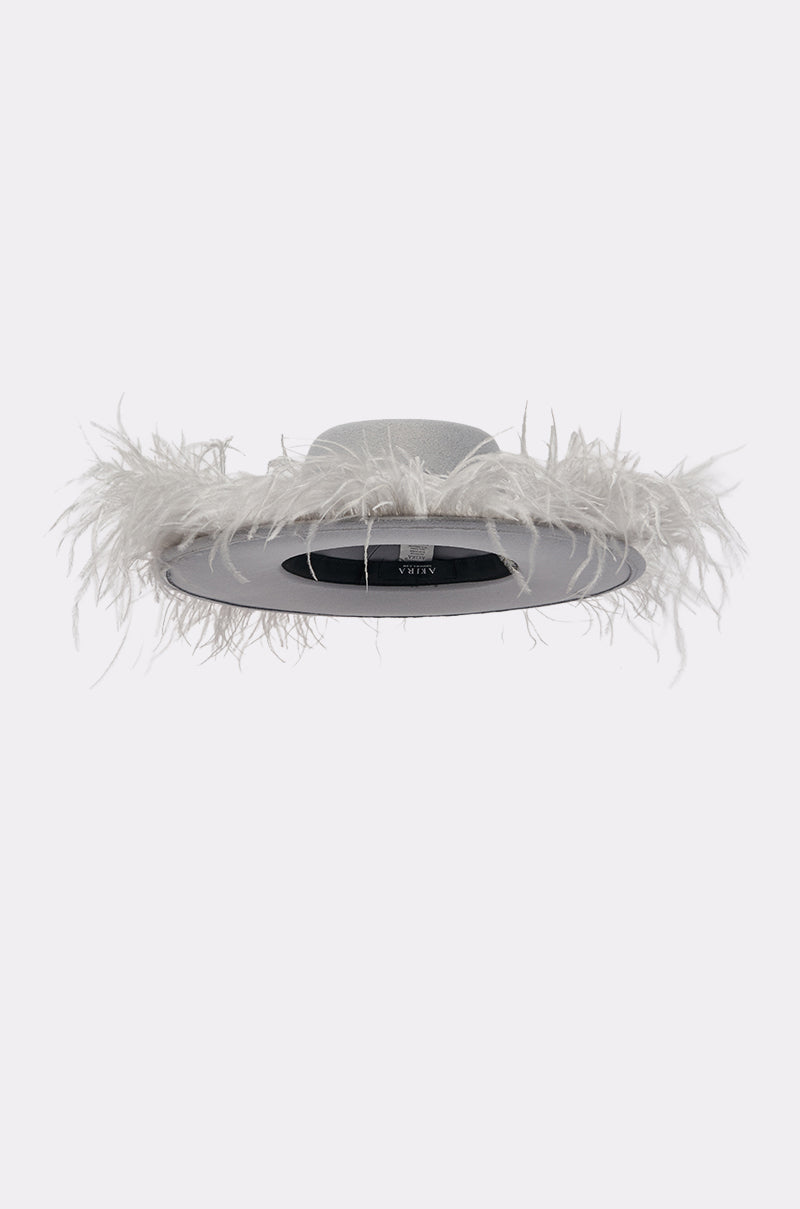 The FEEL IT FEATHER BRIM HAT is a stylish gray wide-brimmed hat featuring a fluffy white feather trim and chic pearl detailing around the brim, shown against a plain light background. 4