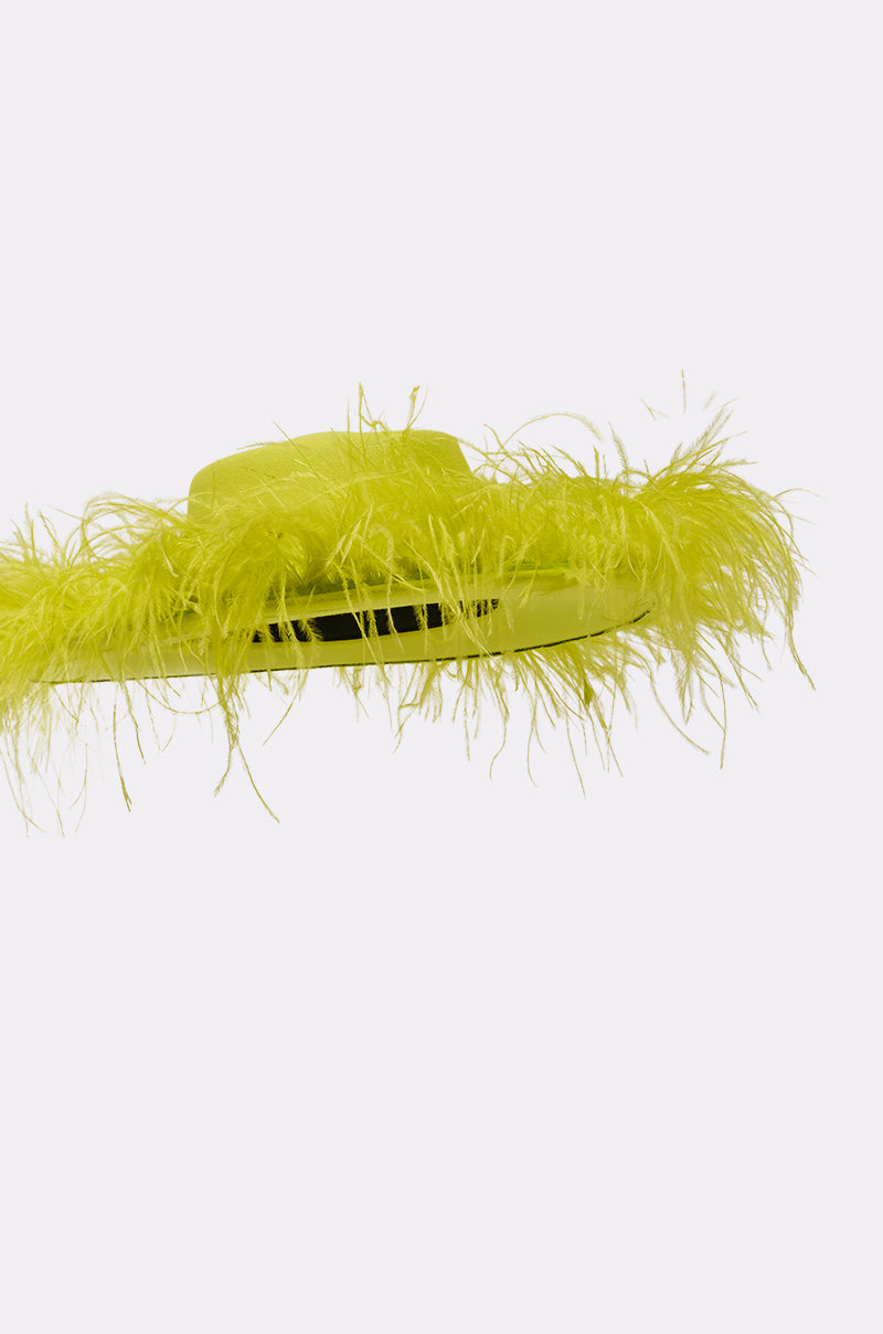 The FEEL IT FEATHER BRIM HAT IN GREEN is a vibrant, wide-brimmed festival cowboy hat adorned with fluffy feathers around the brim, shown on a plain white background. 6