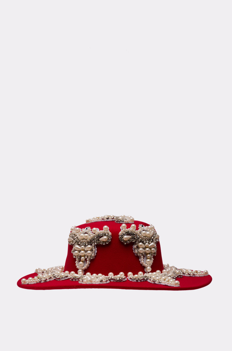 The EDITORS PICK APPLIQUE BRIM HAT features a red, wide brim decorated with pearl rhinestones and gold accents, showcased against a plain light gray background. 7