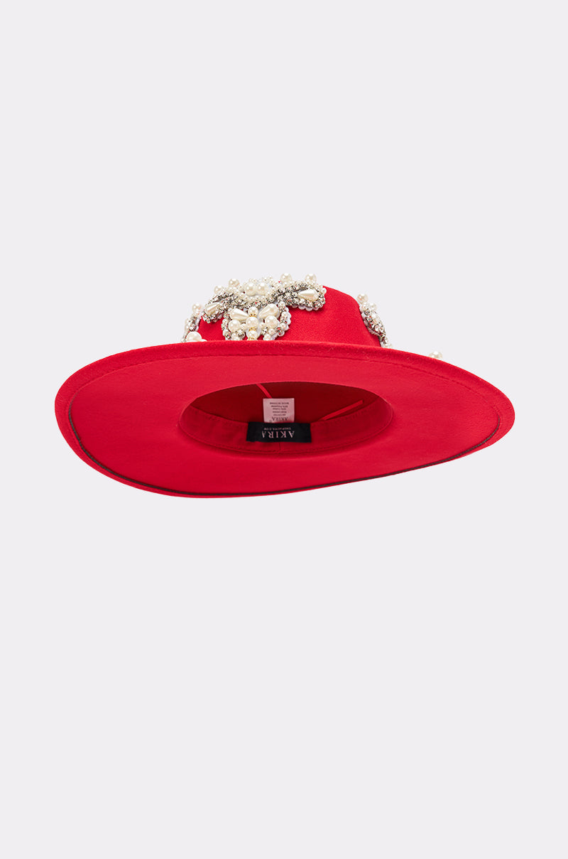 The EDITORS PICK APPLIQUE BRIM HAT is a bright red, wide-brimmed hat with decorative beads and elegant rhinestone details, displayed upside down against a plain light background. 5