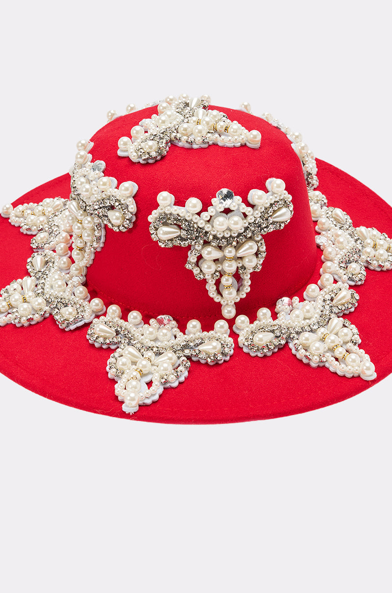 The EDITORS PICK APPLIQUE BRIM HAT is a bright red, wide-brimmed hat adorned with white pearls, silver beads, and ornate rhinestone details for extra sparkle. 6