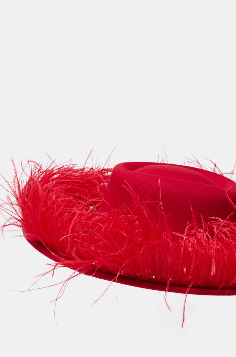 The LETS FLIRT FEATHER BRIM HAT features a wide, bright red brim adorned with matching red feathers along the edge, displayed against a simple light background. 3