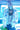 The SPACE CASE METALLIC PUFFER is worn by a person standing in a futuristic setting illuminated by bright blue neon lights. Their ensemble features a mesh top, jeans, and shiny hair clips as they carry a green clutch.