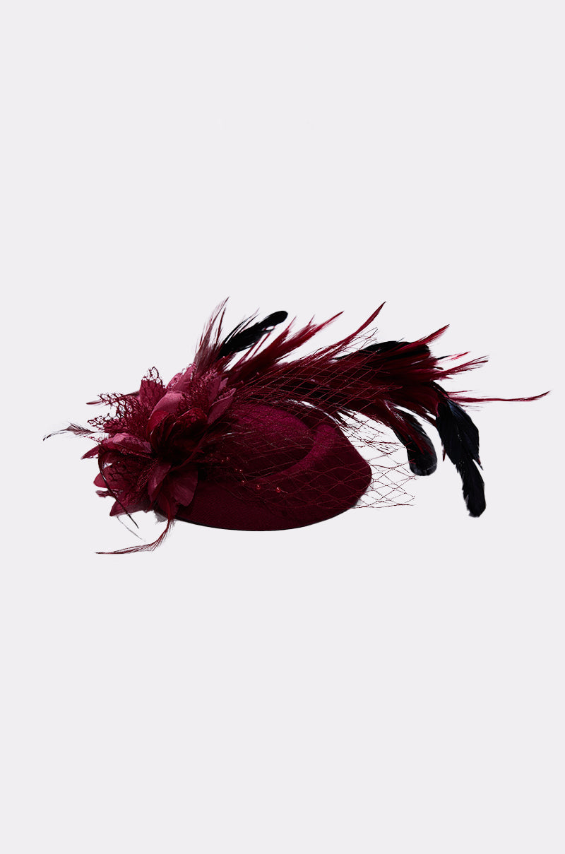 The TOP OF THE DAY CLIP ON FASCINATOR features a large flower, black and burgundy feathers, and decorative netting, shown on a plain light background. 4