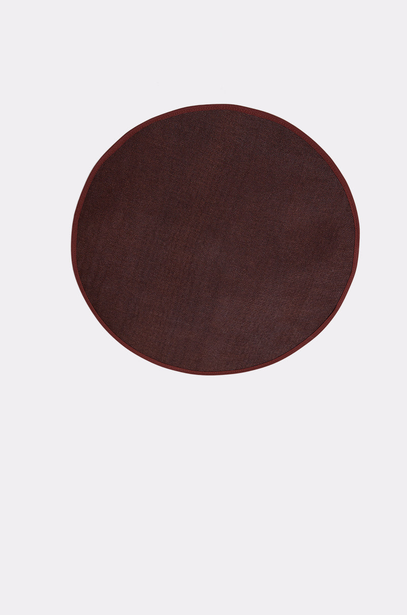 The TOO CHIC CLIP ON HAT—a round, dark brown hat—resembles a fabric placemat and is centered on a plain white background. 4