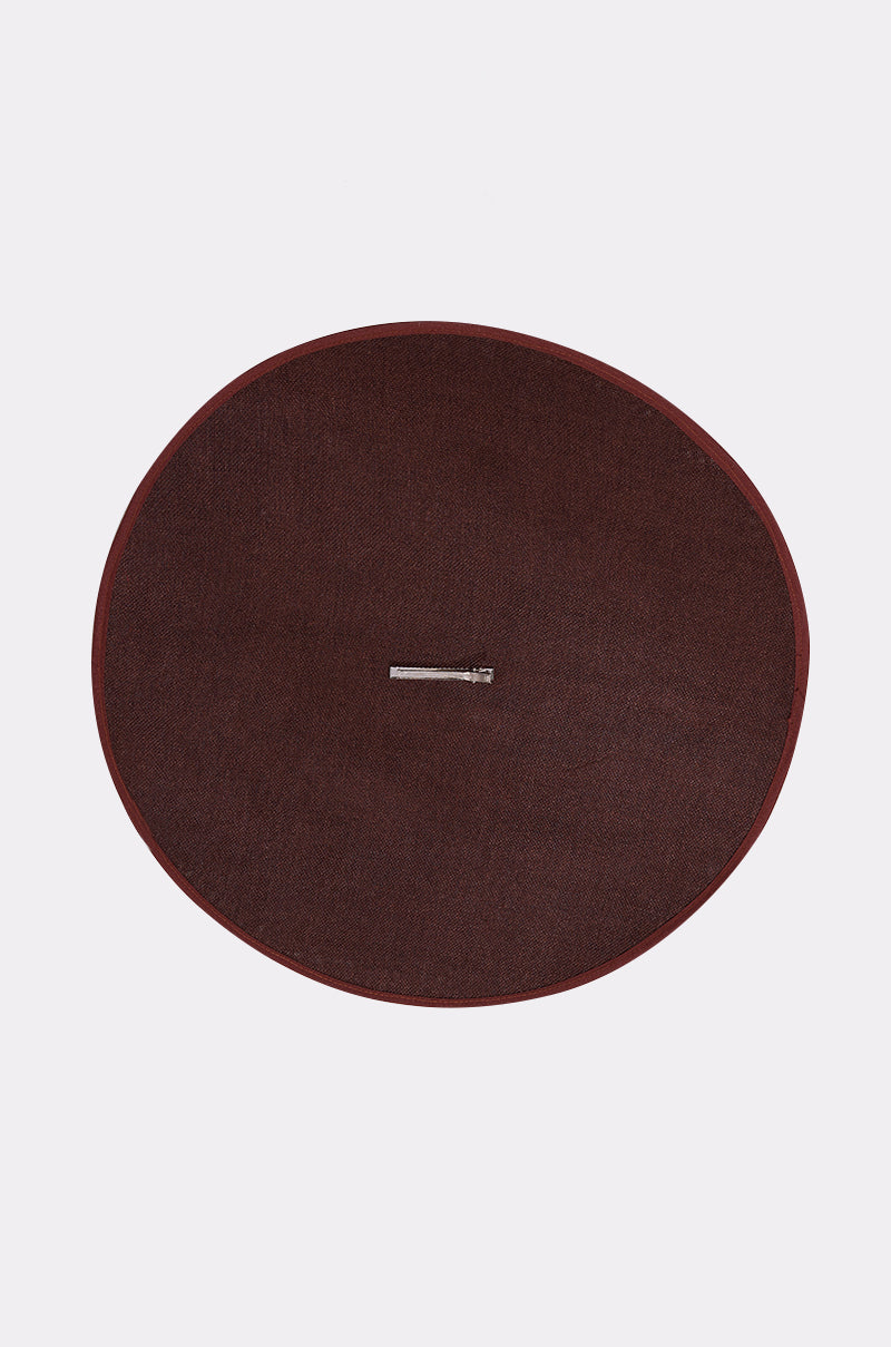 The TOO CHIC CLIP ON HAT features a round brown mat and metal pin, making it a unique hair accessory or stylish hat clip. 5