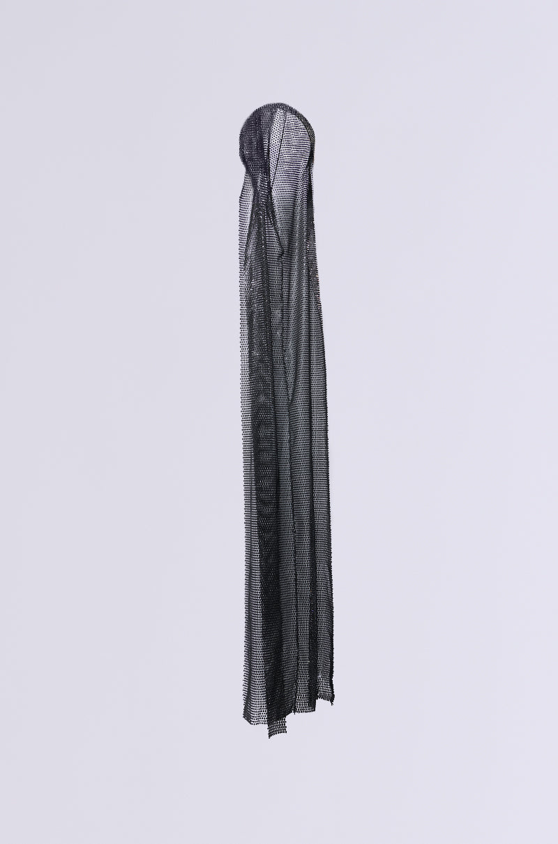 The ONLY THE ELITE RHINESTONE NET DURAG, a long sheer black veil with a self-tie ribbon, hangs elegantly against a white background. The semi-transparent fabric extends downwards in a narrow shape, exuding mystery and allure.