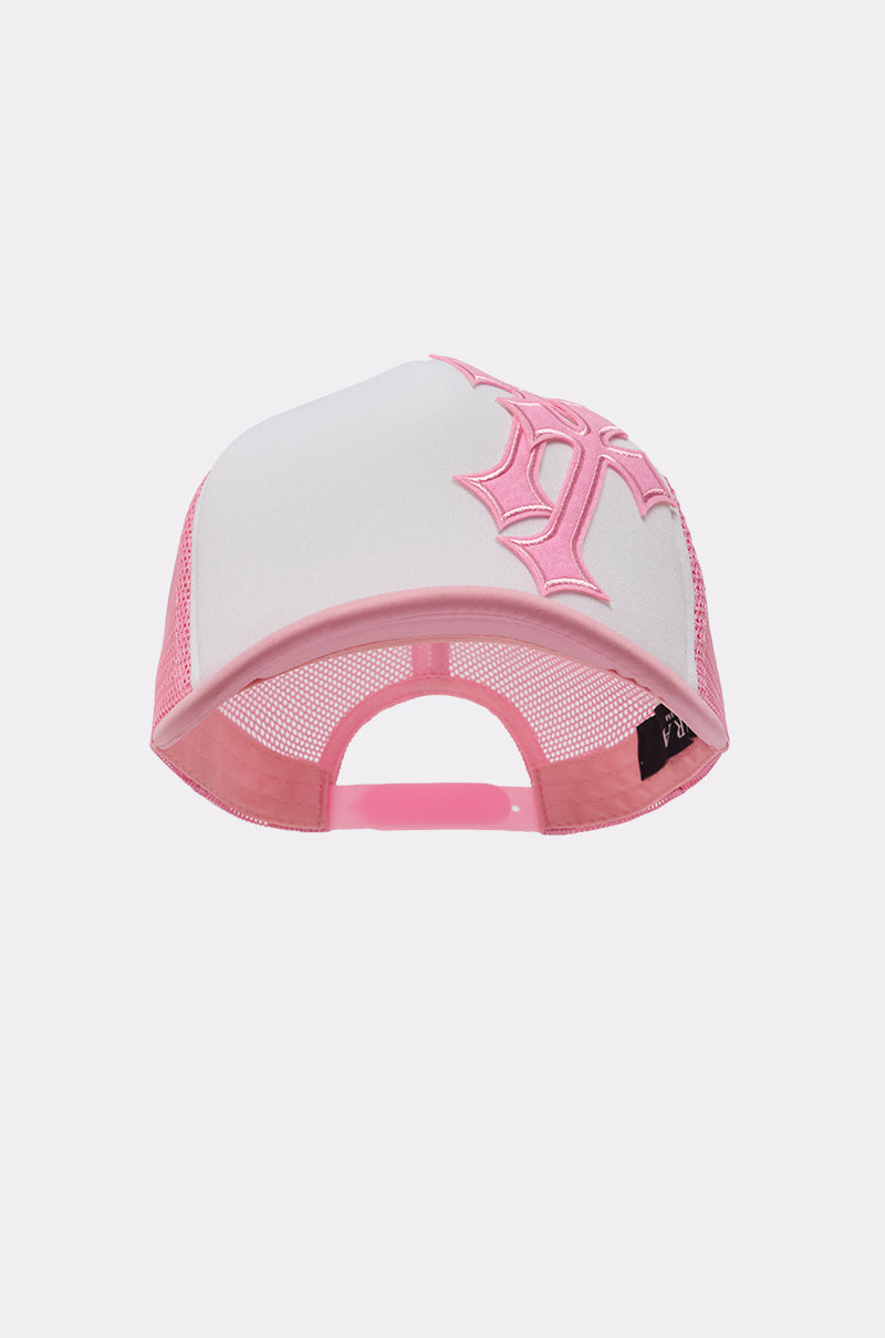 The CROSS ME PATCH HAT is a white and pink trucker cap featuring a large pink embroidered "P" on the front, breathable mesh back, and adjustable snapback closure for street-style comfort. 3